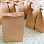 Brown paper bags on table .